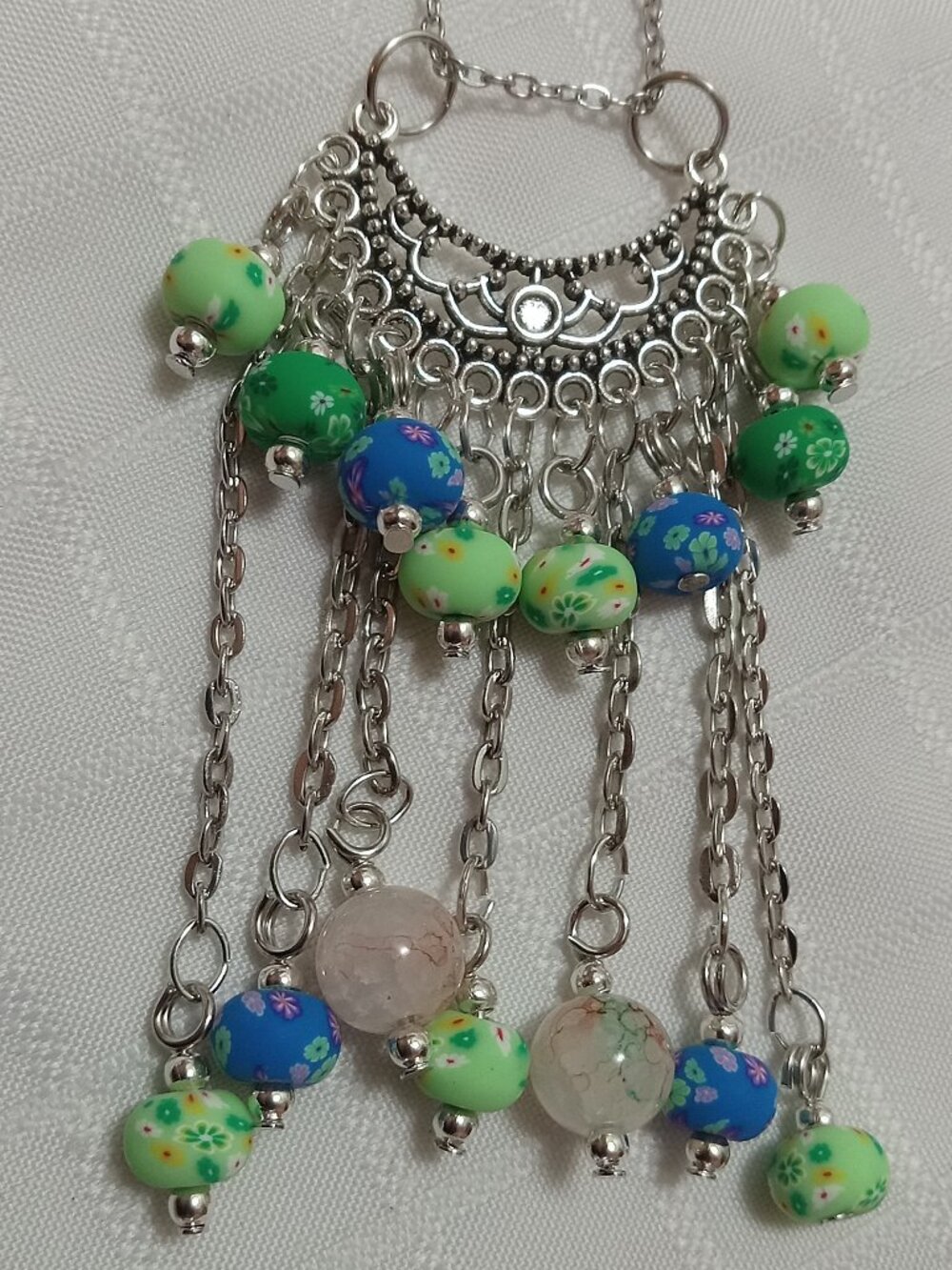 Exquisite handmade necklace featuring a half-moon-shaped Tibetan silver charm